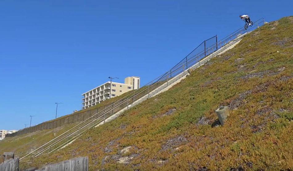 Callan Stibbards doing BMX stunts on a 70 plus stair rail by Calvin Kosovich